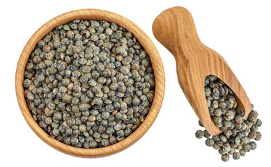 raw french green lentils in wooden bowl and scoop isolated on white background. Top view. Flat lay