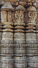 Intricate carvings depict Hindu deities, horses, elephants, and musicians on the panels of Gurjjar Dev Temple in Dwarahat, Uttarakhand, India.