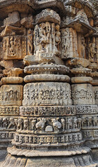 Intricate carvings of Hindu gods, elephants, musicians, and Kirtimukhas adorn the panel walls of the Gujjar Dev Temple in Dwarahat, Uttarakhand, India.