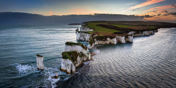 Studland, Dorset, UK - Aerial panoramic view of Old Harry Rocks white cliffs at sunset with dramatic sky. Jurassic coast, Unesco world heritage site, Swanage, Dorset, England, United Kingdom, Europe
