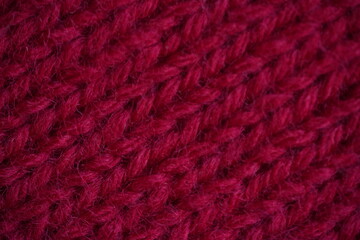 red knitted fabric texture close-up – wool textile background