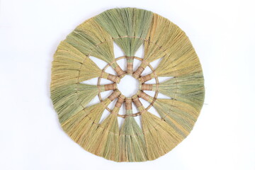 natural straw wall decoration isolated on white