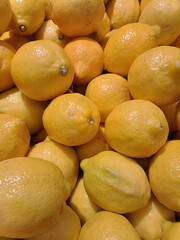 Lemon background. Seasonal immune support with a boost of vitamin C and care for health. Lemons in the market.