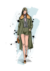 Set of young beautiful women in stylish clothes. Fashion sketch