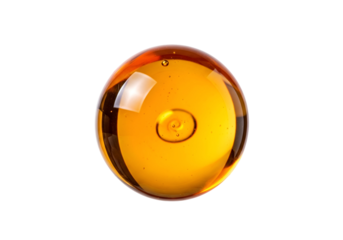 A glossy, amber sphere, brilliantly lit against a black background, reveals a captivating, detailed texture.