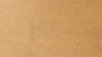 Background of brown kraft paper or cardboard texture. Abstract pattern of beige rough carton, old paper sheet, parchment or papyrus surface.