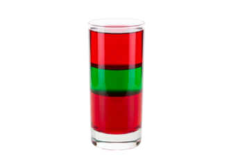 A clear glass cylinder holds layered red, green, and red liquids against a black backdrop.