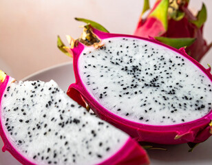 Obraz premium Close Up Bright Fresh Dragon Fruit Slice and Half Food