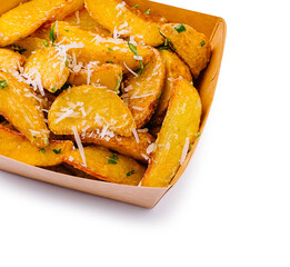 Golden crispy potato wedges topped with cheese and herbs in a takeout box