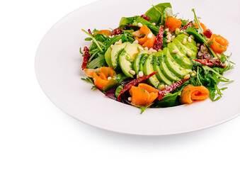 Fresh salad with smoked salmon, avocado, and pine nuts for healthy eating
