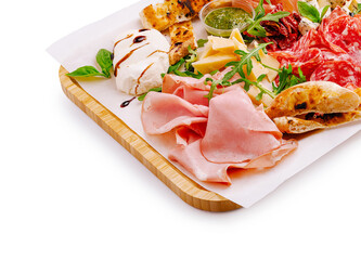 Gourmet platter featuring cured meats, cheeses, and condiments for casual dining