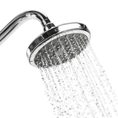 A chrome shower head spraying water