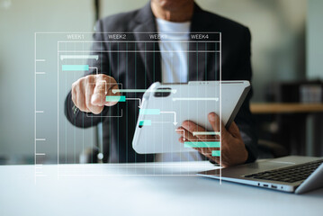 Hands typing on laptop with a digital Gantt chart overlay. Ideal for project planning, scheduling, productivity, workflow,