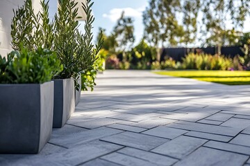 Obraz premium Geometric concrete tiles arranged in a stylish herringbone pattern on a clean outdoor surface 