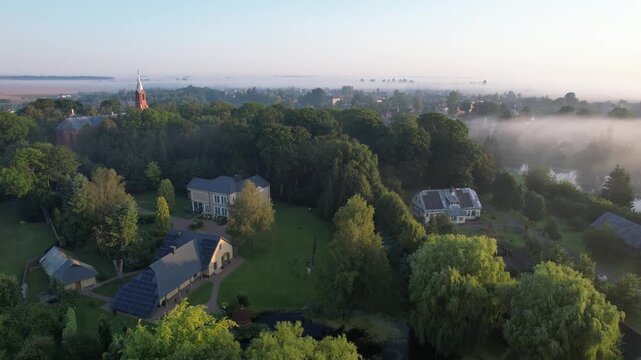Church in the fog dawn in Krakes Lithuania