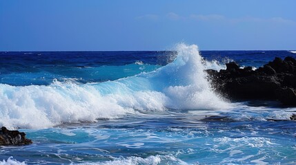 Fototapeta premium Spectacular Seaview: Surging Azure Ocean Waves with White Foam & Water Splashes Under Clear Blue Sky—A Dynamic, Majestic Natural Scene of Sunlight, Fresh Sea Breeze & Vast Tranquility for Healing Vaca
