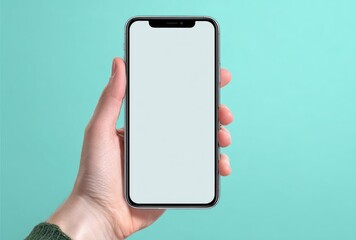 Hand holds a modern smartphone with a blank white screen, displayed against a plain teal background. Bright, clean, and minimalist