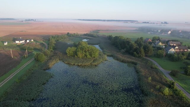 Church in the fog dawn in Krakes Lithuania