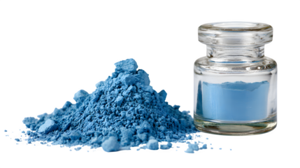 powdered blue pigment next to small glass jar isolated on white background