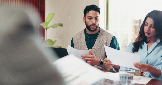 Creative, team and meeting with documents in office, publicist or planning for campaign with client. People, talking and brainstorming with paperwork for proposal, public relations and collaboration
