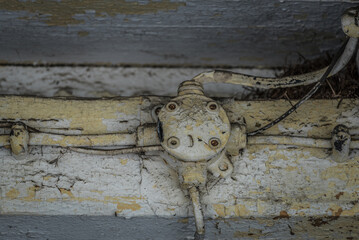 JUNCTION BOX - An antiquated surface electrical installation on a wooden building structure