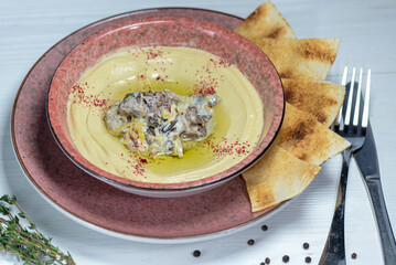 hummus in a plate with decorations