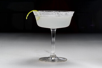 
light cocktail in a glass on a light background