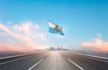 San Marino national flag with mast waving with beautiful skyline. A view from highway. San Marino...