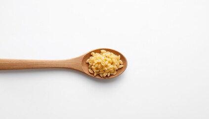 Wooden Spoon with ShellShaped Pasta on White Surface, Minimalist Composition.