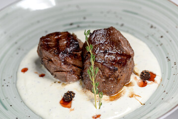 fried meat on a plate on the background