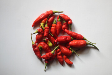 red chilies on a plain white background