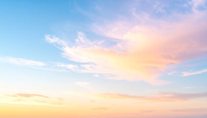 A tranquil sky at sunset with soft pastel clouds glowing in shades of pink and orange, blending beautifully with the blue sky, evoking calmness and peacefulness in a serene evening scene.