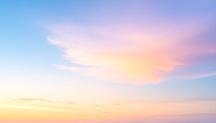 A tranquil sky at sunset with soft pastel clouds glowing in shades of pink and orange, blending beautifully with the blue sky, evoking calmness and peacefulness in a serene evening scene.