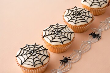 Naklejka premium Spooky spider web cupcakes for Halloween celebration