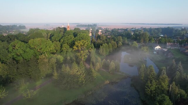 Church in the fog dawn in Krakes Lithuania