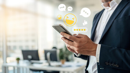 Businessman using smartphone with social media emojis, chat bubbles, thumbs up, and five-star rating icons floating, concept of online communication, customer feedback, social network 