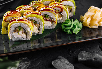 Exquisite sushi roll with mango topping