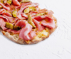 Italian mortadella pizza with artichokes on white background