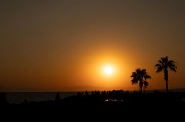 Silhouettes of People Enjoying a Sunset by the Sea Side, Antalya