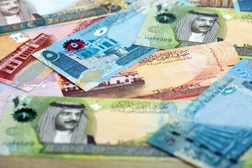 Bahraini dinar currency money bills. The current banknotes lies on table in big amount