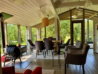 Modern and stylish interior of a country house on a summer day. High quality photo