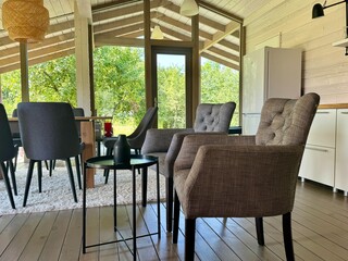 Modern and stylish interior of a country house on a summer day. High quality photo