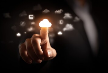 A hand touches a glowing cloud icon surrounded by other digital symbols, on a dark background, conveying connectivity and digital solutions
