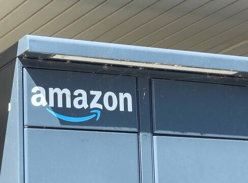 Amazon locker unit with logo under sunny sky