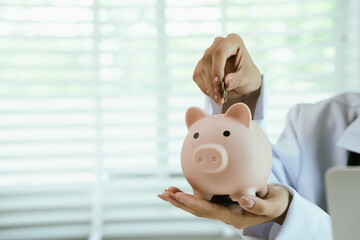 A piggy bank with a stethoscope symbolizes health insurance, medical savings, financial planning,...