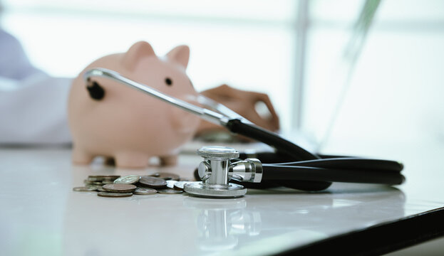 A doctor inspects finances with health concepts, linking insurance, savings, investment, and medical care for future security, prosperity, and wellness.