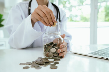A piggy bank with a stethoscope symbolizes health insurance, medical savings, financial planning,...