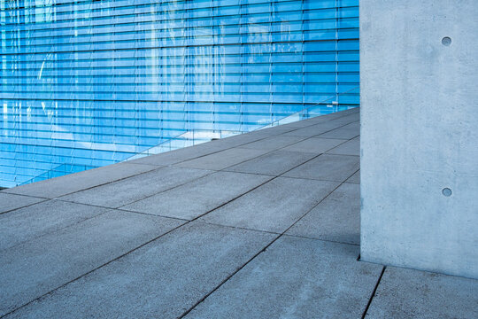 Minimal urban floor and concrete structure with blue wall, abstract architectural detail symbolizing geometry, clarity, design, modern background and contemporary construction