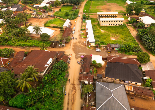 Aerial view of the vibrant Amaolu Community with contrasting rooftops and lush greenery lining the streets, Orlu, Imo, Nigeria.