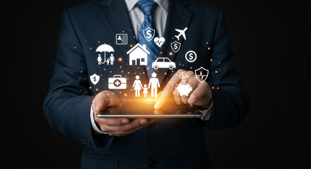 Close-up of businessman holding tablet with floating insurance icons.